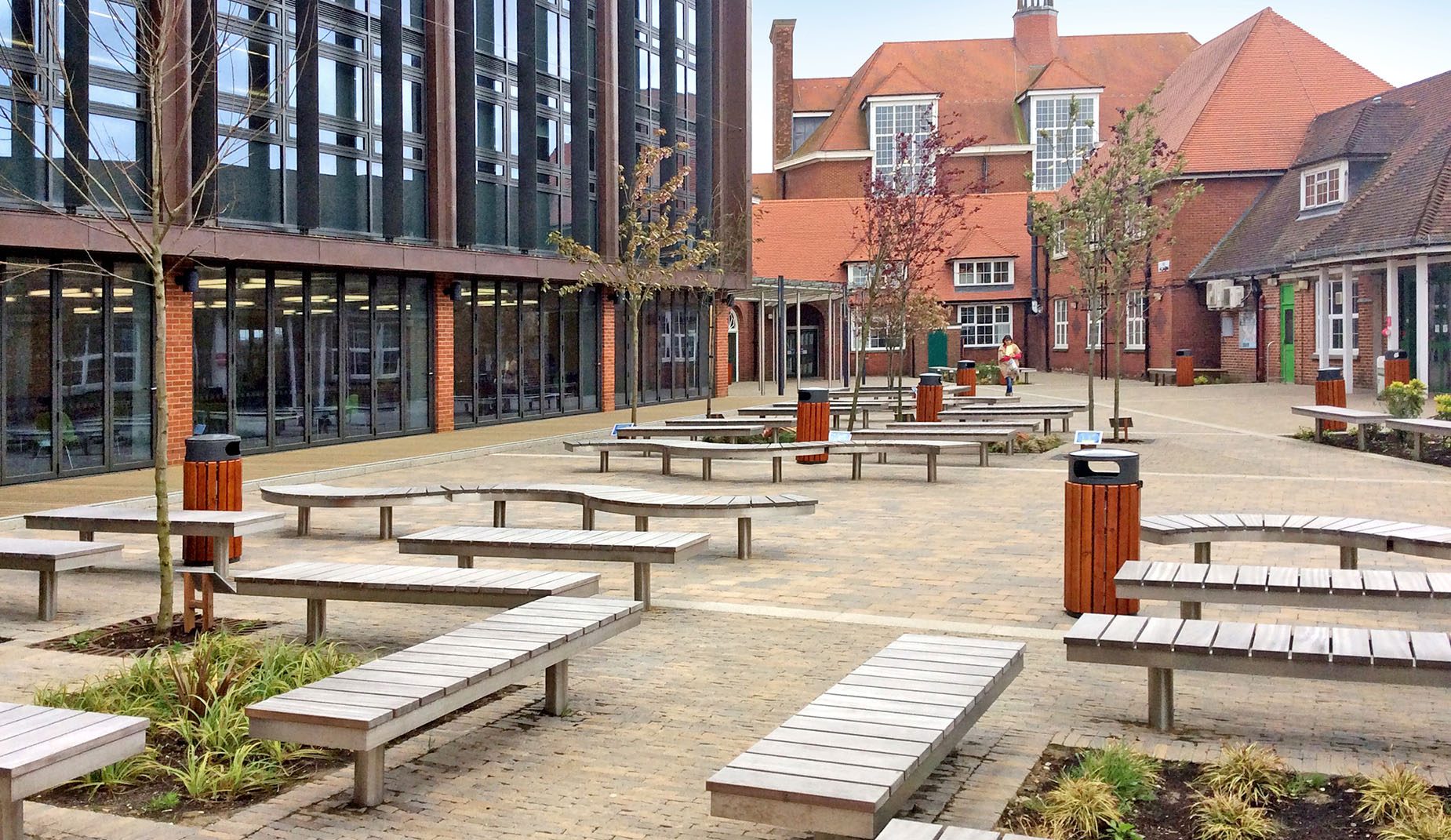 CHRONOS Benches in a paved courtyard